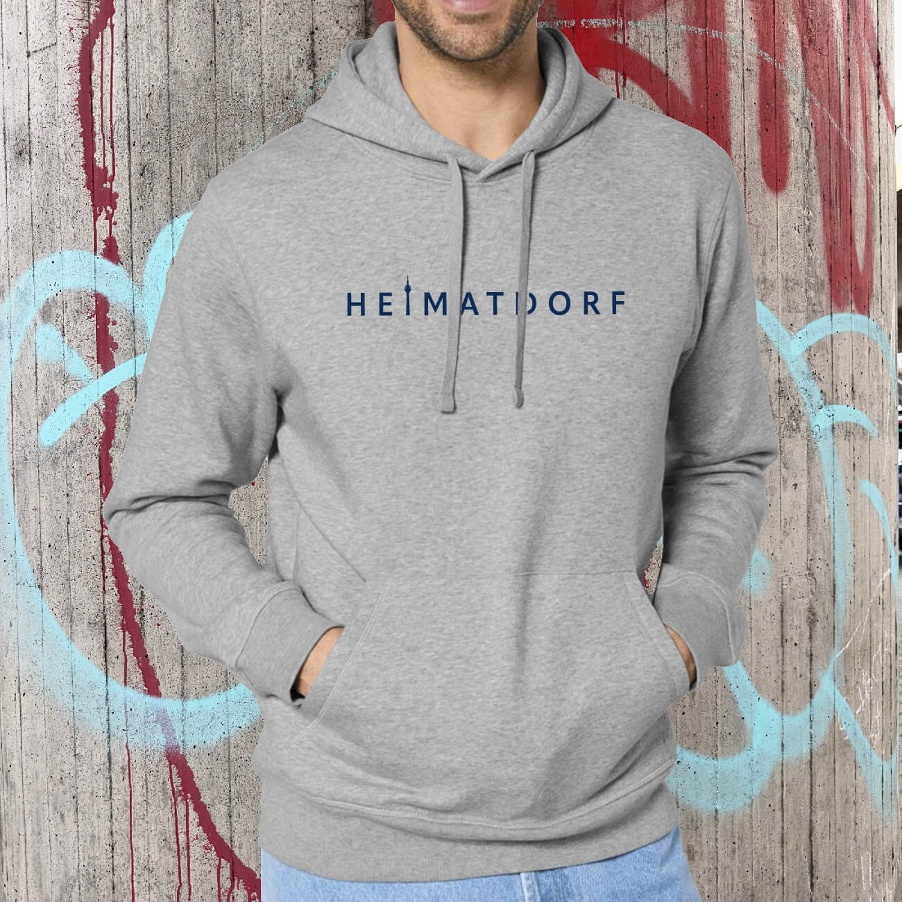 Düsseldorf HeimatDorf Hoodie in heather grey mit dunkellauem Schriftzug Heimatdorf auf der Brust.