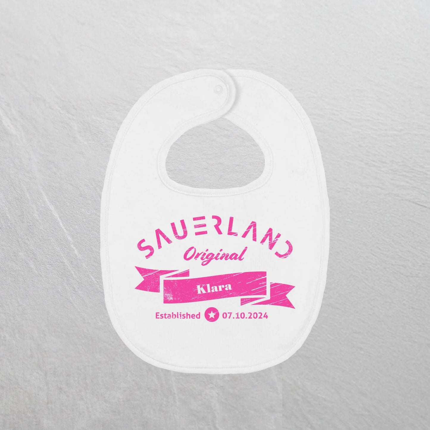 Produktfoto des Sauerland Baby lätzchen in weiß und pink